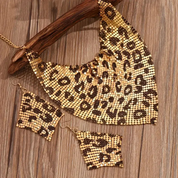 Leopard sequin print jewelry set for women, featuring a triangular scarf-style necklace and statement earrings with an exaggerated clavicle chain design
