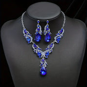 Women’s blue crystal jewelry set with a teardrop pendant and matching earrings, elegant style for weddings and formal occasions
