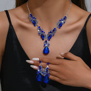 Women’s blue crystal jewelry set with a teardrop pendant and matching earrings, elegant style for weddings and formal occasions