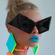 Black oversized futuristic sunglasses with sharp geometric frames – a bold statement accessory that adds drama and edge to any outfit.