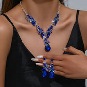 Women’s blue crystal jewelry set with a teardrop pendant and matching earrings, elegant style for weddings and formal occasions