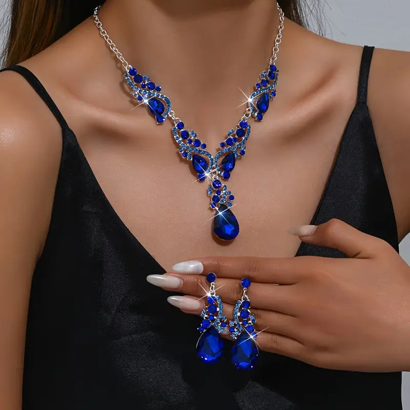Women’s blue crystal jewelry set with a teardrop pendant and matching earrings, elegant style for weddings and formal occasions